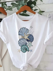Coastal Marine Life Graphic White Crew Neck T Shirt With Colorful Scallop Shell Starfish And Plant Illustration Perfect For Beach