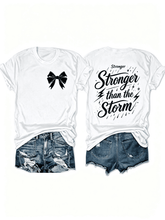 “Stronger Than the Storm” Front Bow Back Print T-Shirt – Inspirational Resilience Tee for Women, Motivational Casual Top