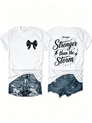 “Stronger Than the Storm” Front Bow Back Print T-Shirt – Inspirational Resilience Tee for Women, Motivational Casual Top