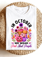 In October We Wear Pink And Purple Pumpkin Ghost Floral Graphic T‑Shirt, Fall Halloween Casual Short Sleeve Tee