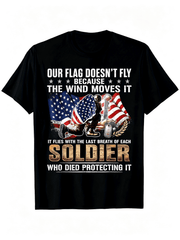 “Our Flag Doesn’t Fly Because The Wind Moves It” Veteran Memorial T-Shirt – Patriotic Soldier Tribute Tee for Men, USA Flag Short Sleeve Gift