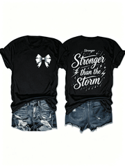 “Stronger Than the Storm” Front Bow Back Print T-Shirt – Inspirational Resilience Tee for Women, Motivational Casual Top