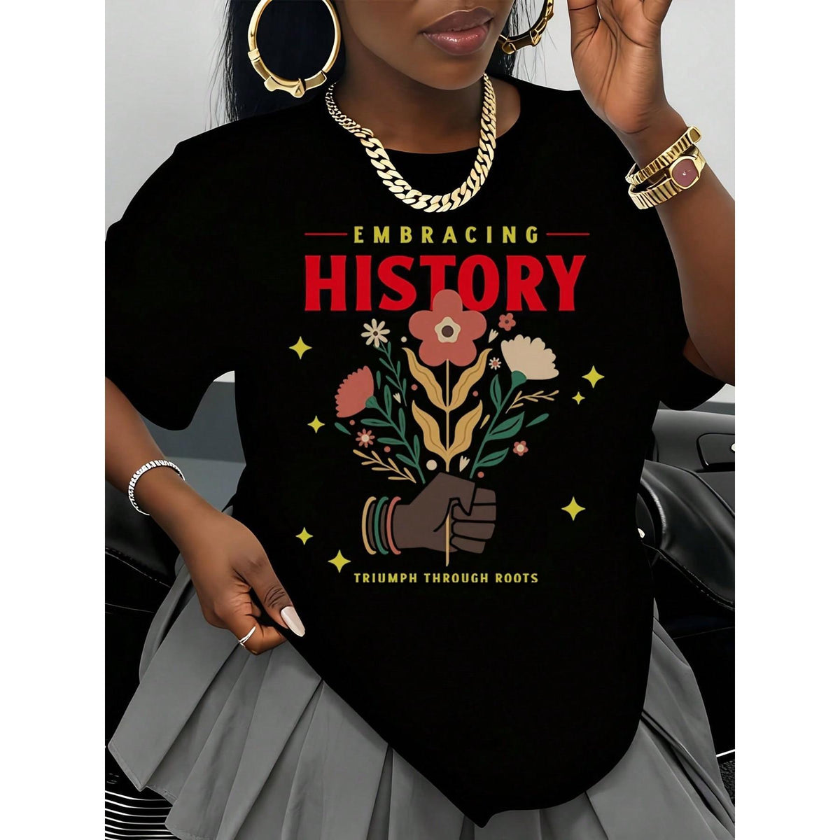Embracing History Triumph Through Roots T Shirt With Floral Design And Raised Fist Graphic For Women